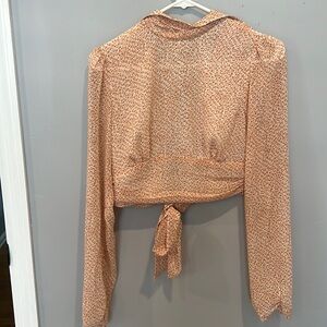 High neck open back blouse. New with tags